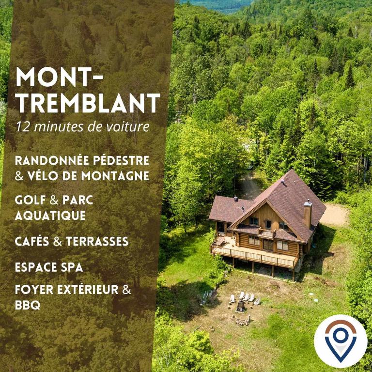 a sign for a home in the middle of a forest at Rustic Chalet & Serenity in Mont Blanc in Saint-Faustin