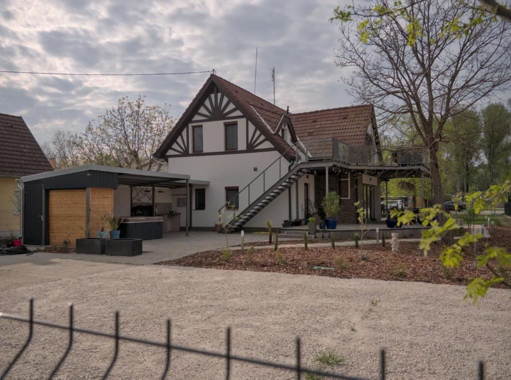 a house with a gambrel roof at Vadvirág Villa in Soltvadkert
