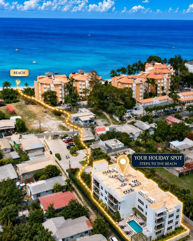 an aerial view of a city with the ocean at Modern 2BR Beachside Haven Ground Floor and Pool in Saint Peter