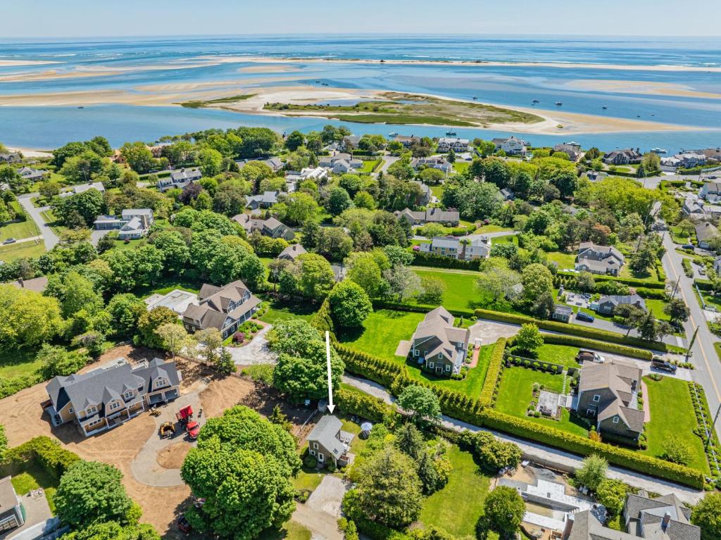 an aerial view of a neighborhood with houses and the water at Cape Cod Cottage near Beaches & Downtown in Chatham