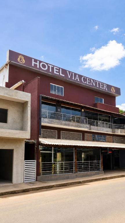 a hotel vga center with a red building at Hotel Via Center in Divino