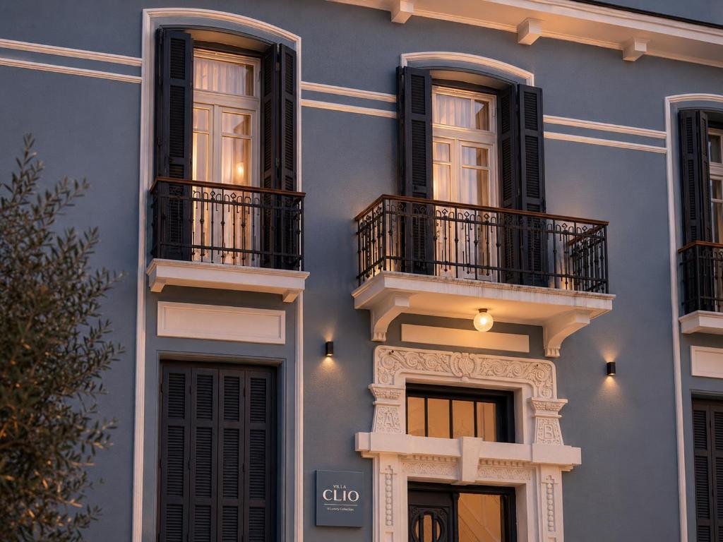 a blue building with black windows and balconies at Villa Clio, a Luxury Collection in Thessaloniki
