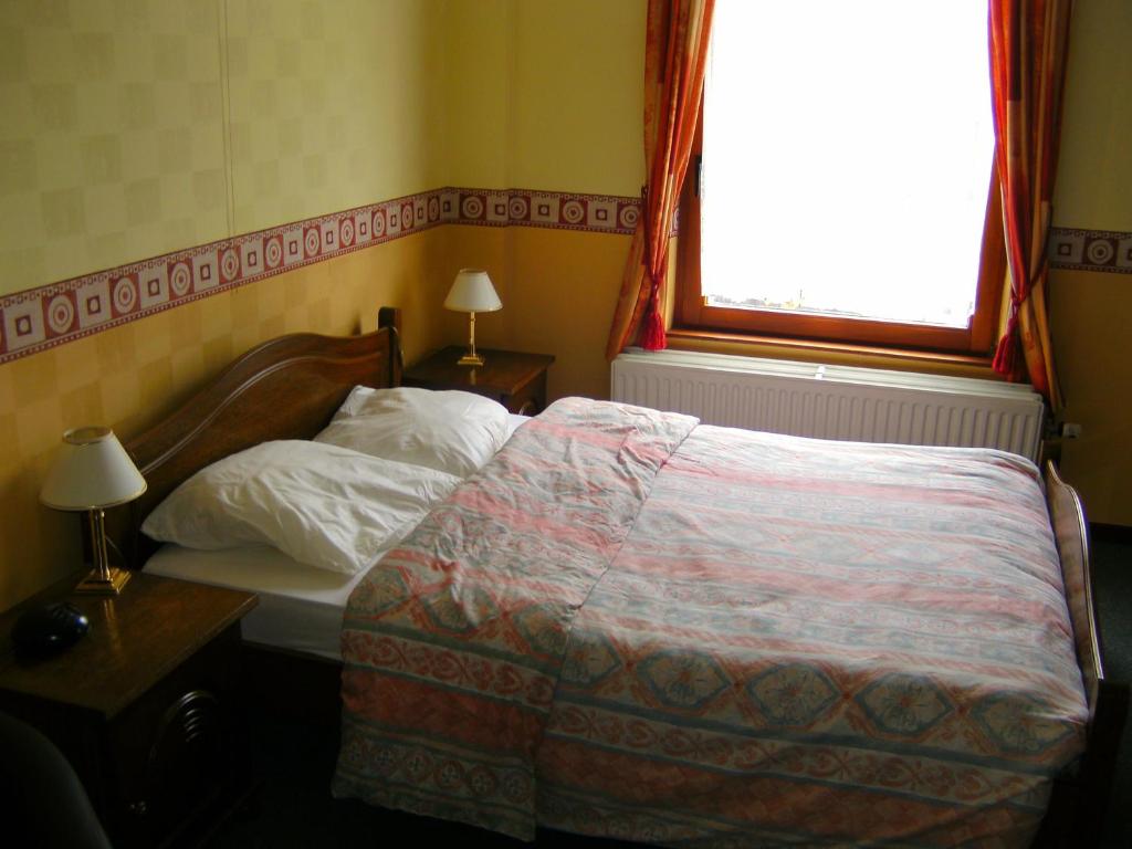 Postel nebo postele na pokoji v ubytování B&B Le Petit Normand