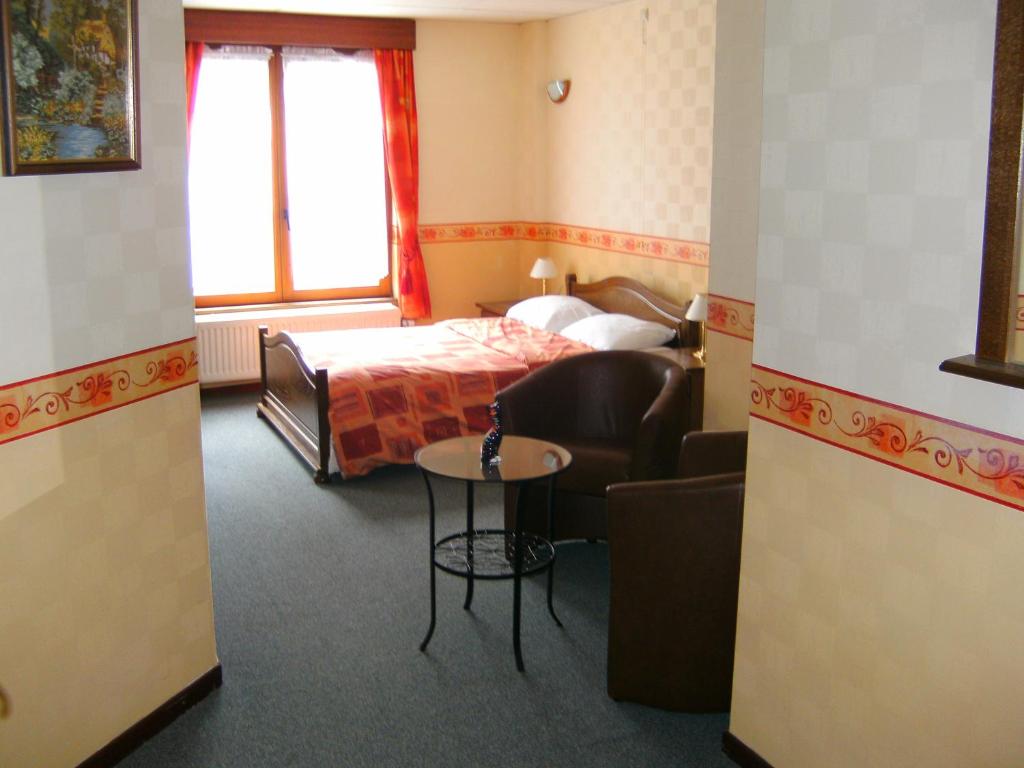 Postel nebo postele na pokoji v ubytování B&B Le Petit Normand