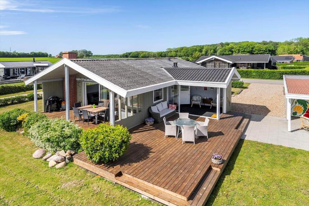 an aerial view of a house with a wooden deck at 40322-Juelsminde-Frede-Juels-vej-261 in Sønderby