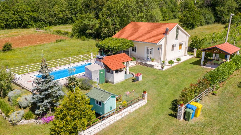 an aerial view of a house with a swimming pool at Villa with pool near Split in Krušvar