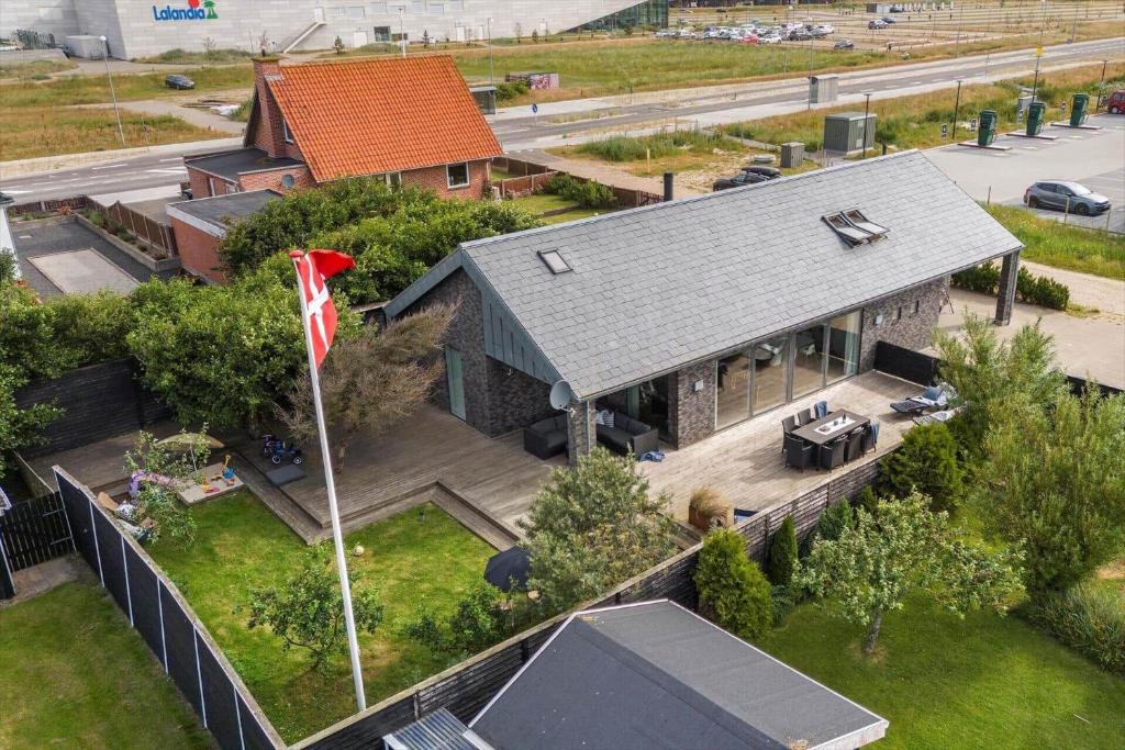 an aerial view of a house with a flag at 173-Ringkobing-Sondervig-Landevej-29 in Søndervig