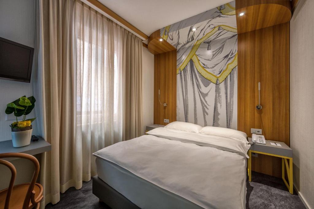 Voodi või voodid majutusasutuse Albergo Carcani by Ketty & Tommy toas
