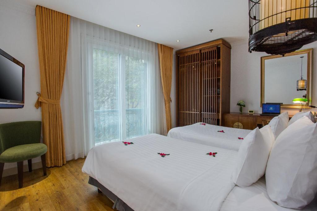 Postel nebo postele na pokoji v ubytování Hanoi Media Hotel & Spa