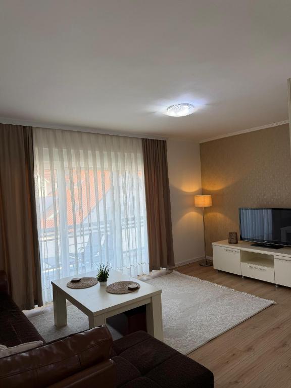a living room with a couch and a table at Mimi's Place in Gradačac