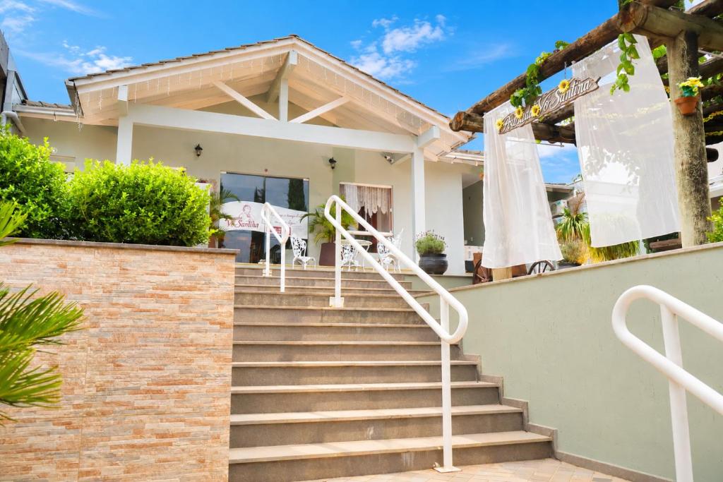 a set of stairs leading to a house at Pousada Vó Santina in Protásio Alves
