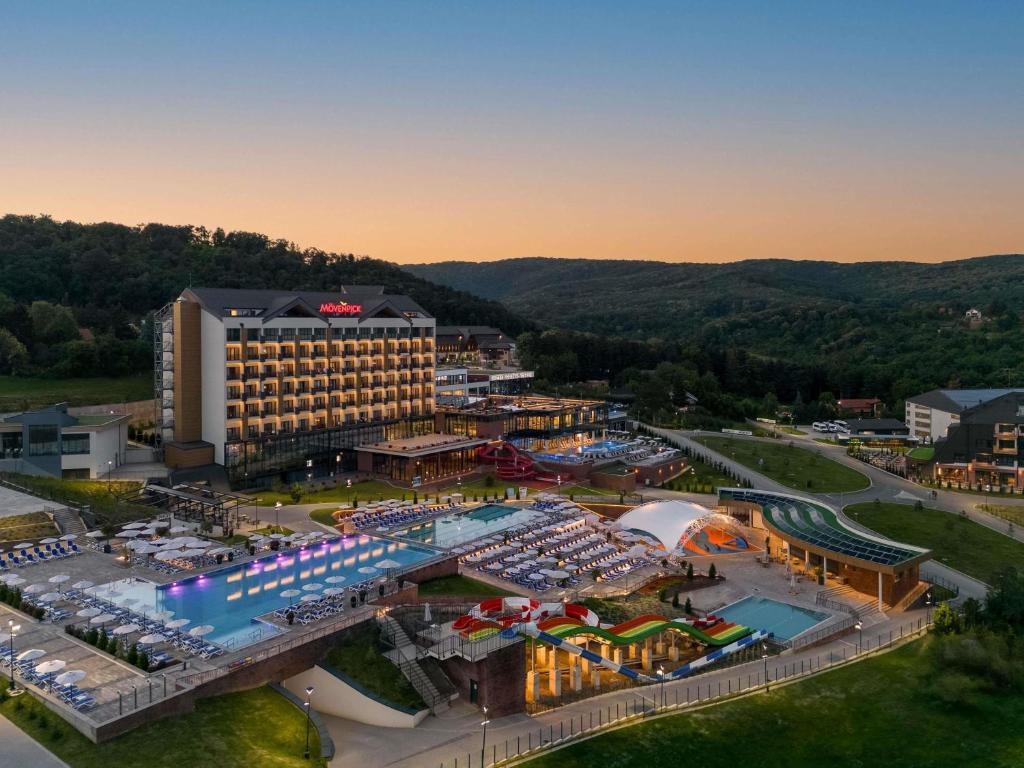 an aerial view of a resort with a pool at Movenpick Resort and Spa Fruske Terme in Vrdnik