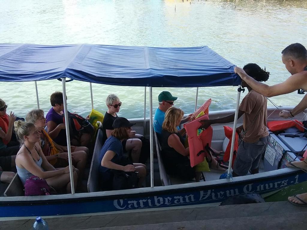 a group of people on a boat in the water at Hotel Caribbean View in Bastimentos