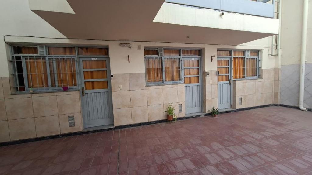 an empty building with doors and windows on it at Alto Unimev II in Guaymallen