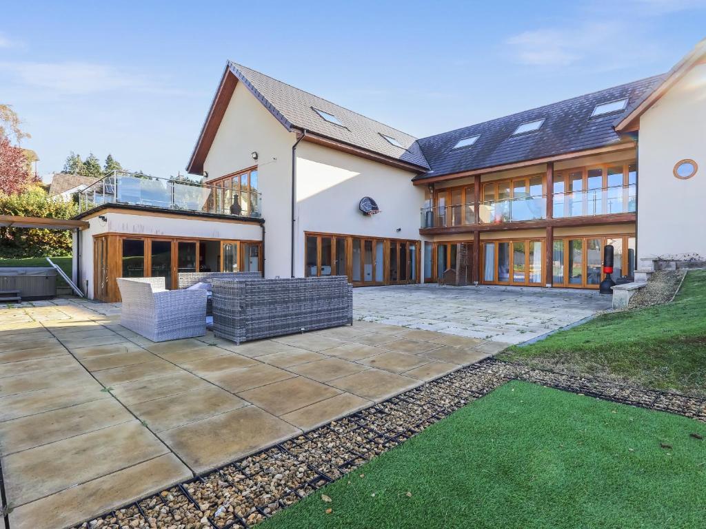 an exterior view of a house with a patio at High View House in Kemeys Inferior