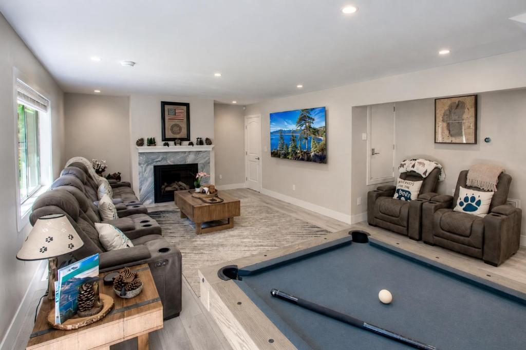 a living room with a pool table in it at Creek Side Summit home in Stateline