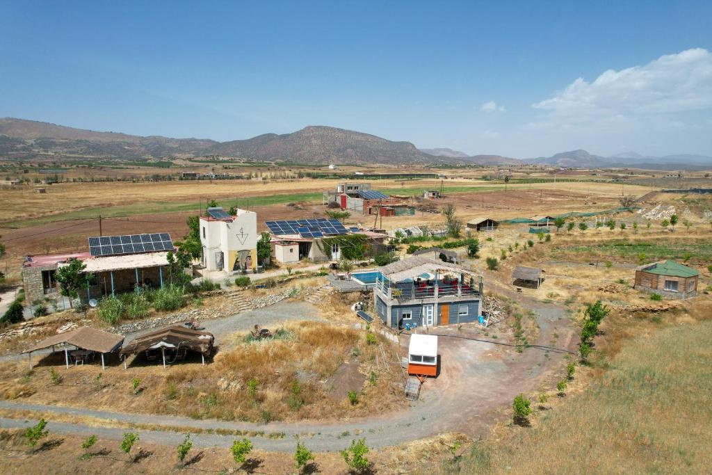 an aerial view of a house in a field at Gîte Touften in Aït Aïouz