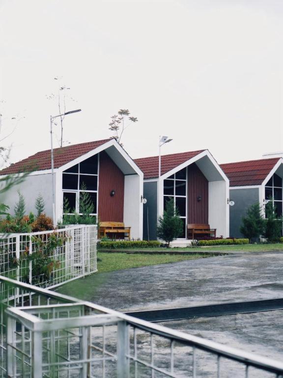 a building with a fence in front of it at CYB Merbabu Resort & Cafe in Kembang