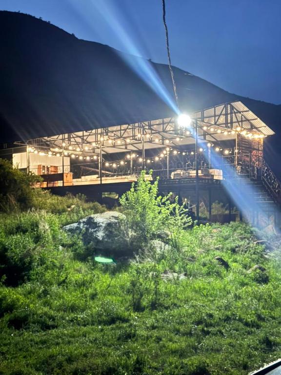 a large building with lights in front of it at KochevniK in Almaty