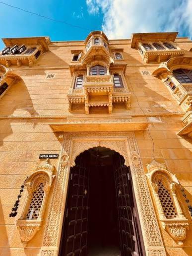 a tall building with an entrance to a building at Vedsa haveli new in Udaipur