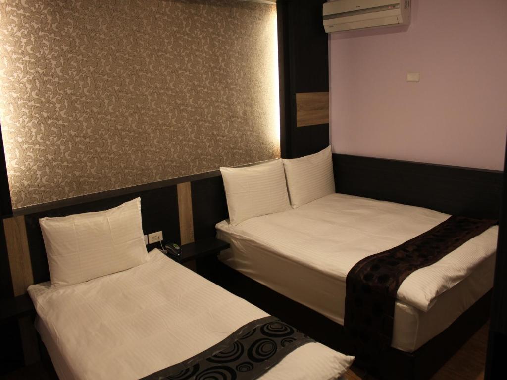 Postel nebo postele na pokoji v ubytování Shan Shui Hostel