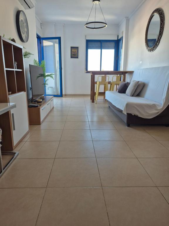 a large living room with a large tile floor at Aire de Levante in Alicante