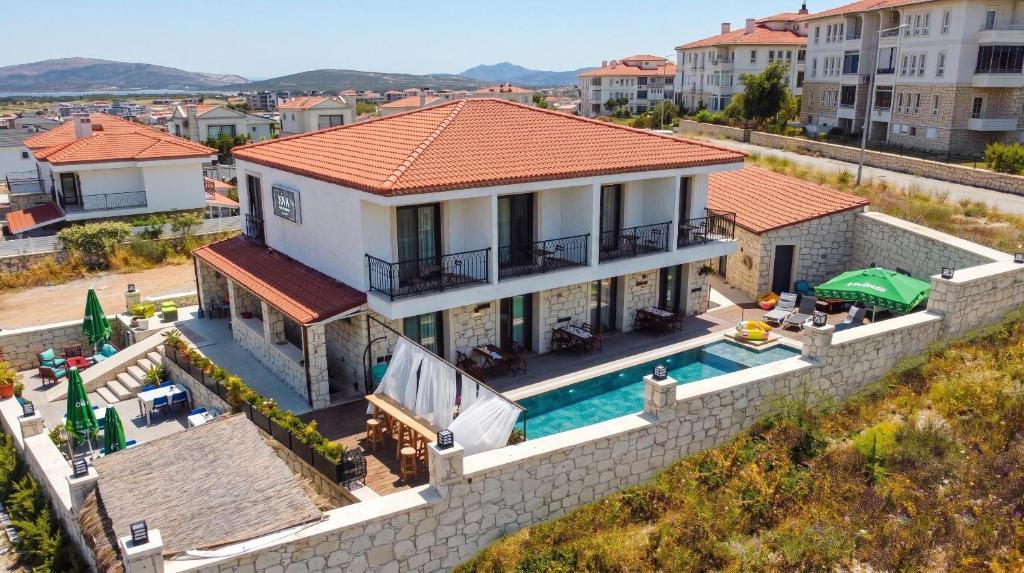 an aerial view of a house with a swimming pool at Kiva Alaçatı Hotel By Amarillo in Çeşme