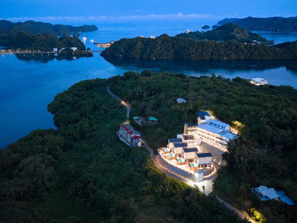 an aerial view of a resort on an island in the water at Palau Mangrove Hotel in Koror