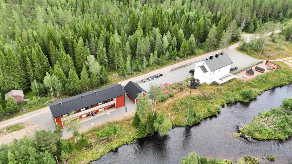 an aerial view of a building next to a river at Villa Fregn in Ljørdalen