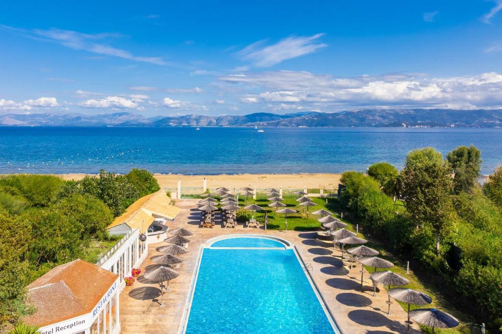 an aerial view of a resort with a swimming pool and a beach at Koulouris Beach Hotel in Kavos