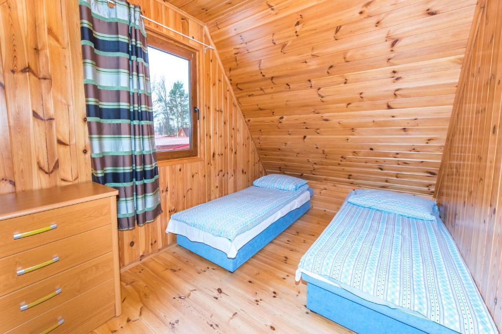 Postel nebo postele na pokoji v ubytování Domki Kempingowe Krzysztof