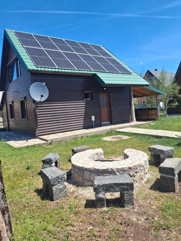 a house with solar panels on top of it at House Negro Žabljak in Žabljak