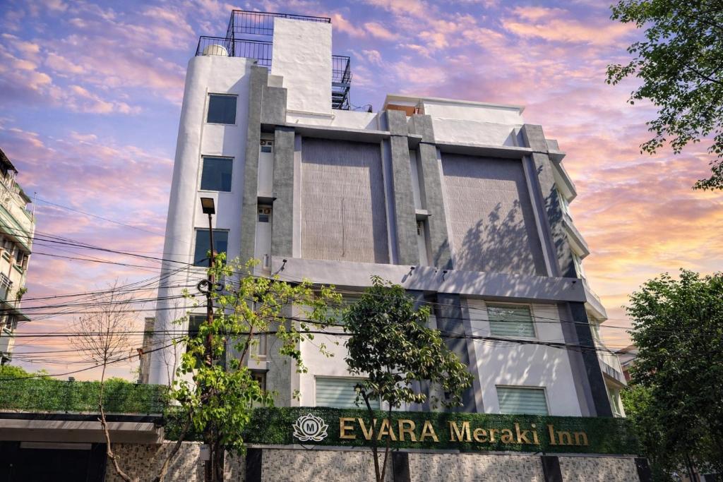 a building with a sign in front of it at Evara-Meraki Inn in Kolkata