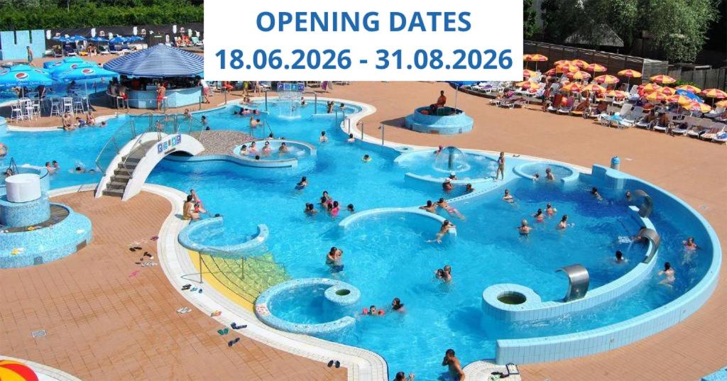 a large pool with people in it at an amusement park at Ljubljana Resort Hotel & Camping in Ljubljana