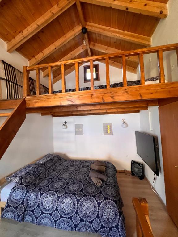 a bedroom with a bed and a loft at Princeps De Cura Traditional in Symi