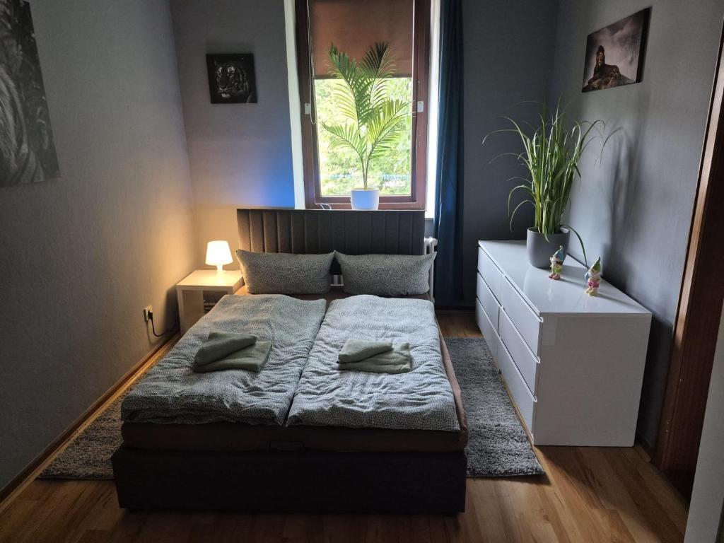 a small bedroom with a bed and a window at Flensburg City 4 1 in Flensburg