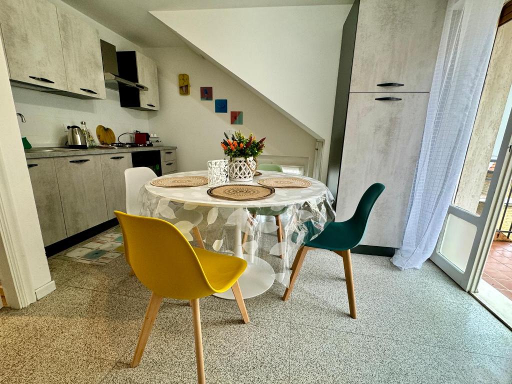 a dining room with a table and two chairs at ARIEL'S house in San Benedetto del Tronto