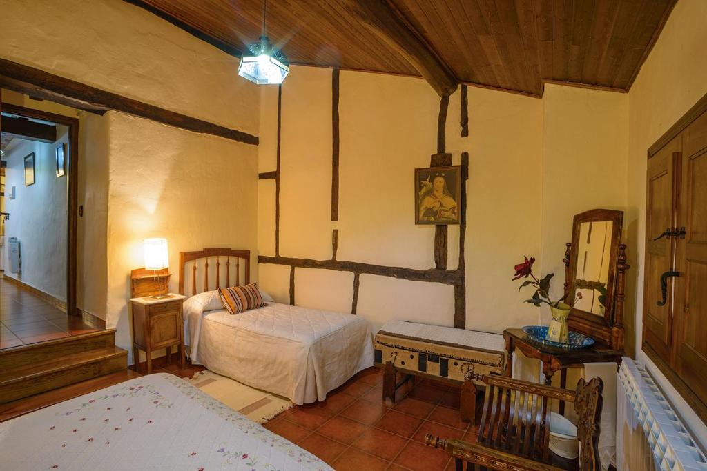 Cama o camas de una habitación en Apartamentos Rurales Tía Josefa