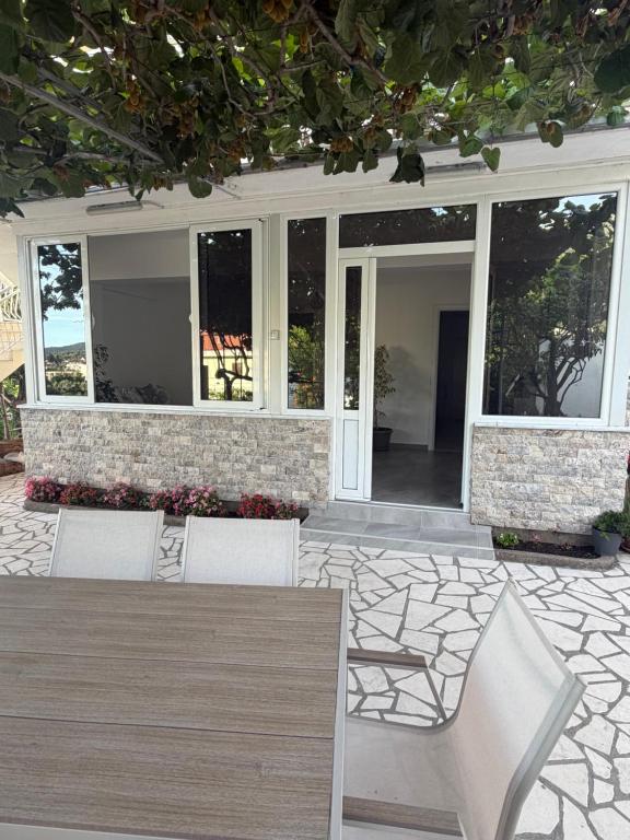 a patio with two chairs and a table at Fortress Apartment in Bar