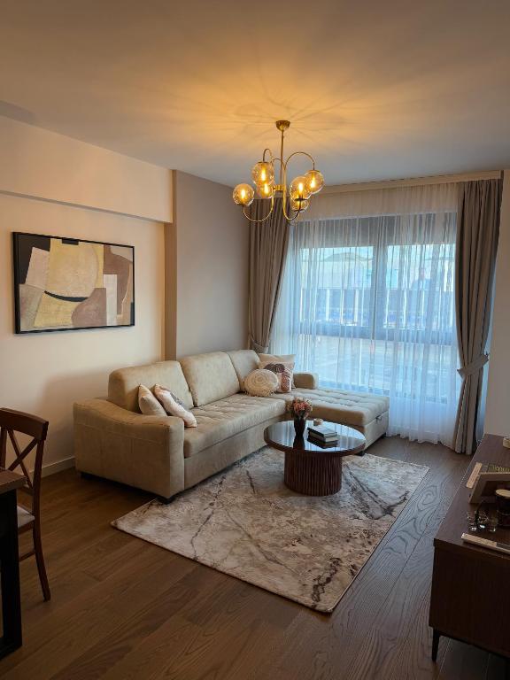 a living room with a couch and a table at Harbour Light Residence in Bjeliši