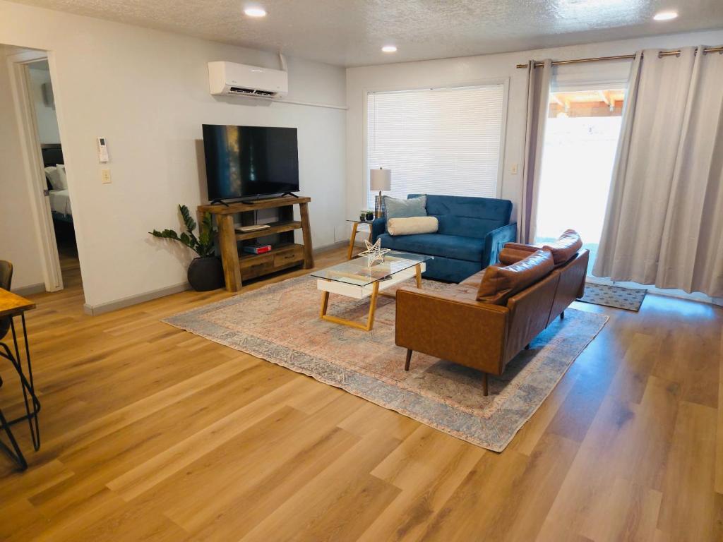 a living room with a couch and a tv at Siesta Sunset in Boise