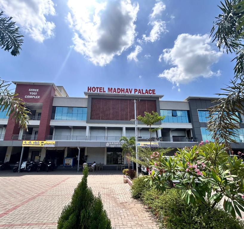 a hotel malaysia palace with a sign on it at Hotel Madhav Palace in Māndvi