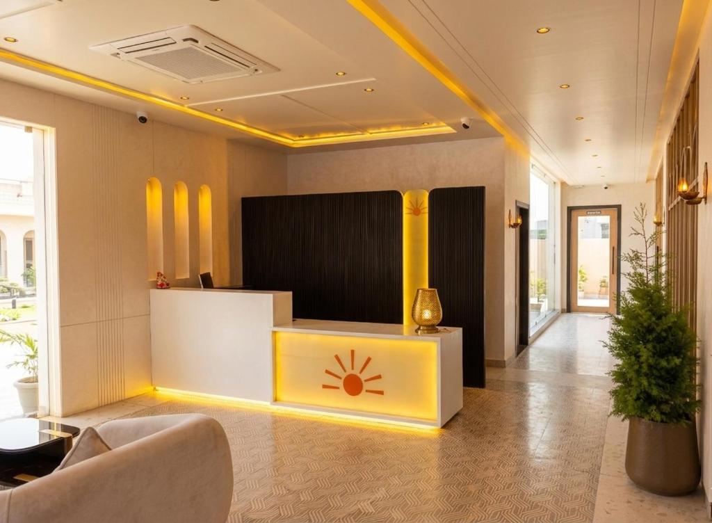 a lobby with a reception desk in a building at Novosol Lux- A Premium Hotel Near Airport in Jaipur