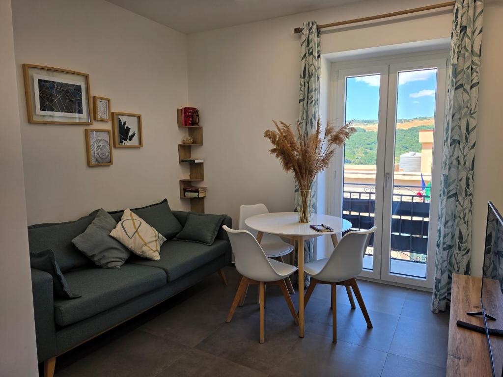 a living room with a couch and a table at VeraLuce in Caltavuturo