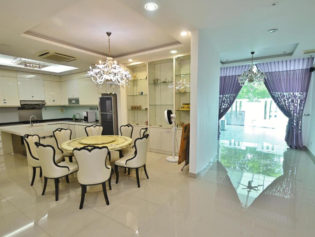 a kitchen and dining room with a table and chairs at Large Group KTV Stay, Near Setia Alam, Klang in Klang