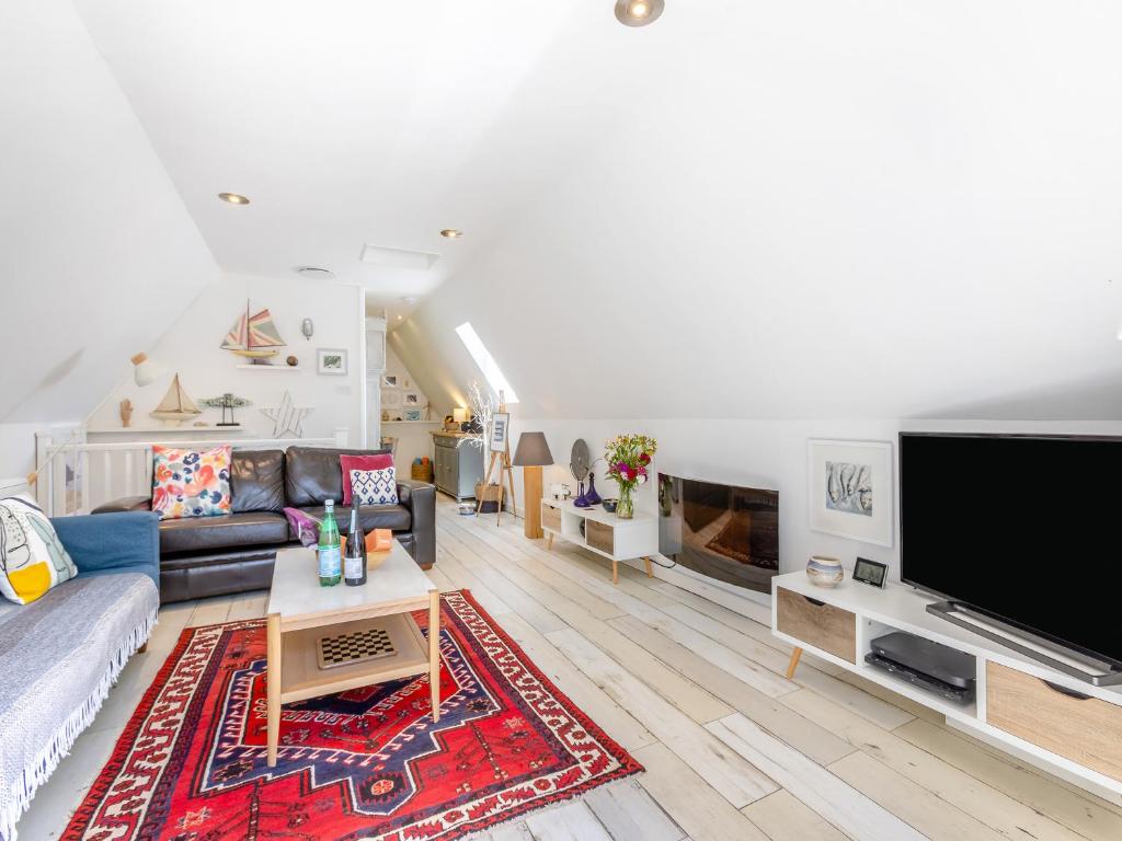 a living room with a large flat screen tv at Valley Lodge - Uk49228 in Gunnislake