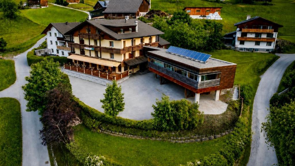 an aerial view of a large house with a building at Residenz Dunza Hotel Garni in Bürserberg