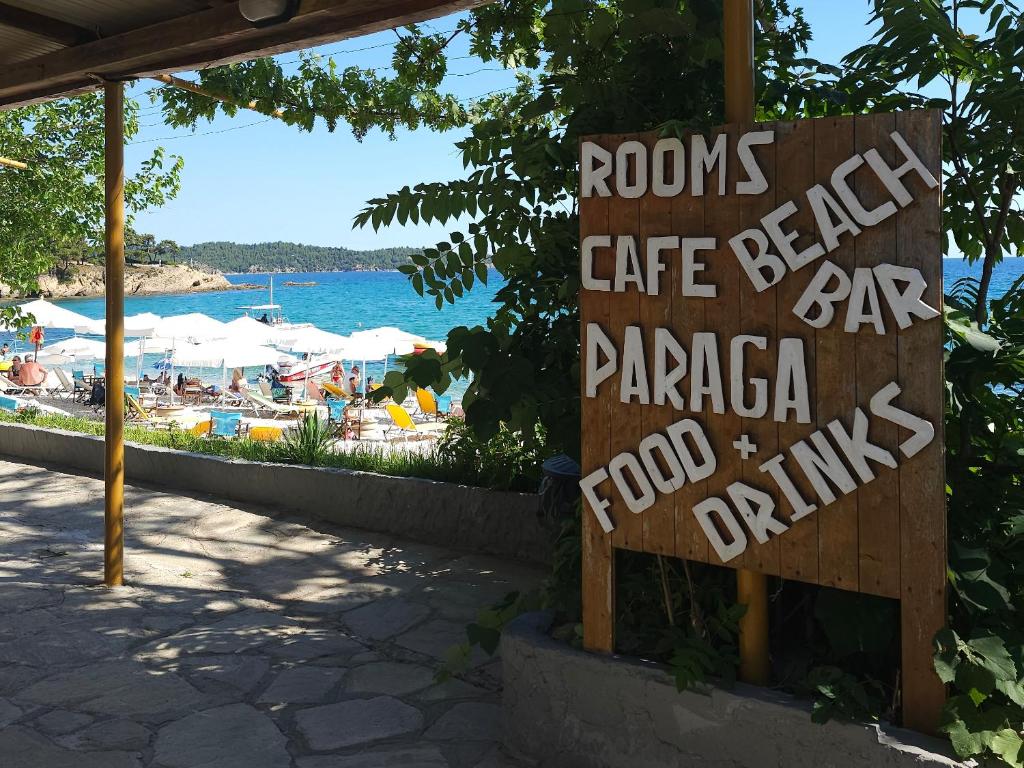 a sign that reads rooms cafe bakery bar parapa food drinks at Paraga Rooms Pefkari in Pefkari