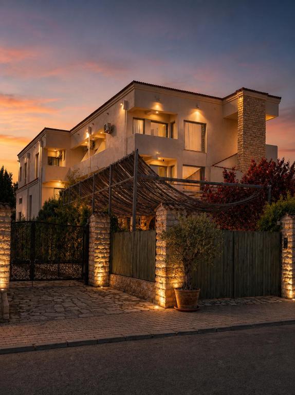 a large house with lights in front of it at Artelier Vama Veche in Vama Veche