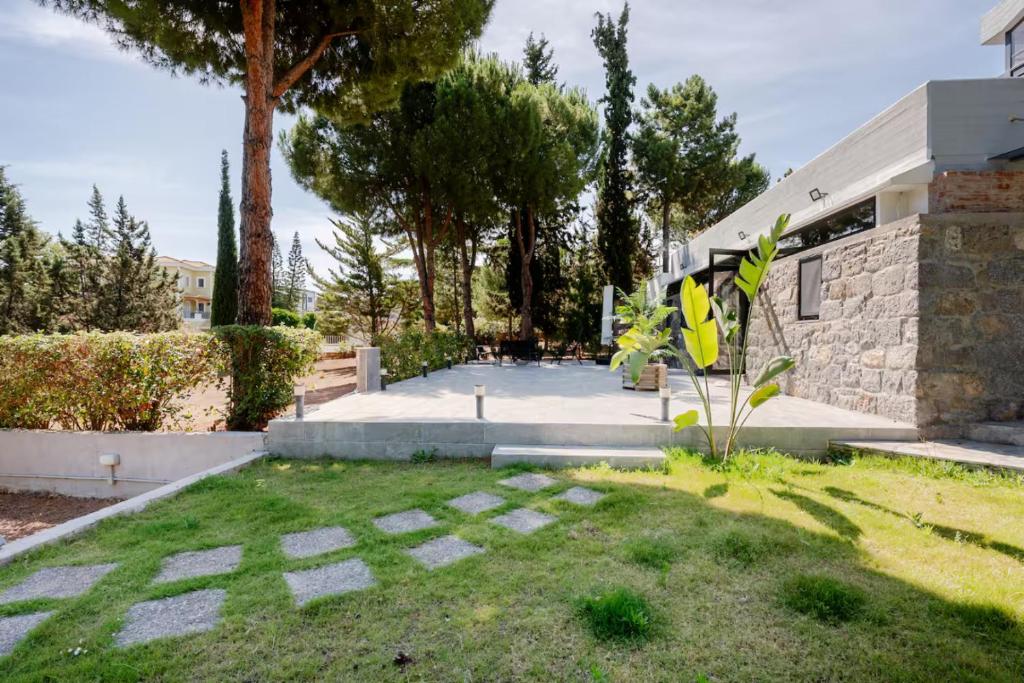 a garden in front of a house at Lemon Tree Villa in Chalkida